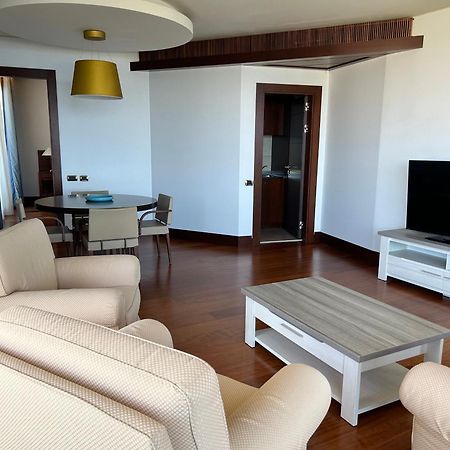 Smy Carlos V Wellness & Spa Alghero Esterno foto A living room in a modern apartment