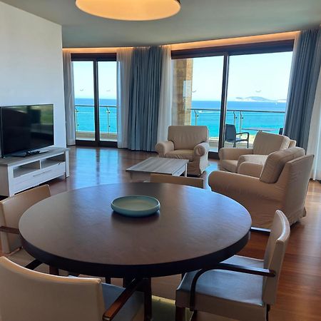 Smy Carlos V Wellness & Spa Alghero Esterno foto A living room in a suite at the Westin Resort Costa Navarino