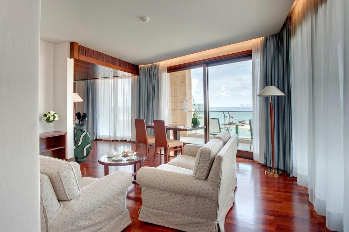 Smy Carlos V Wellness & Spa Alghero Esterno foto A suite at the hotel